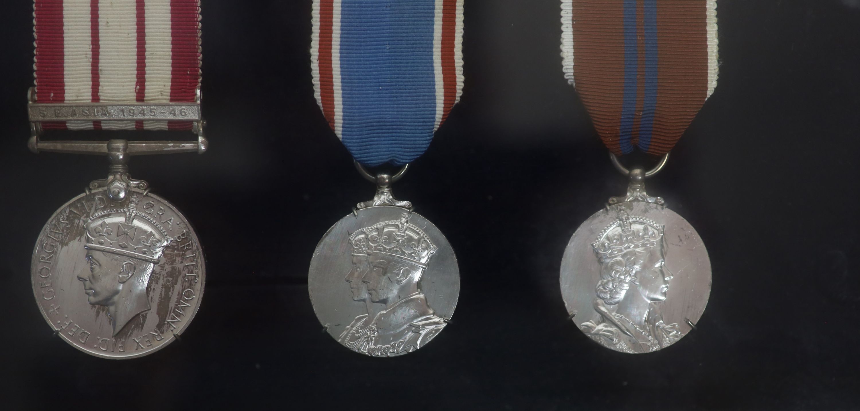 A cased WWI, WWII and Military C.B. medal group to Rear-Admiral John Dent R.N. (1899-1973) and a cased KCVO and Order of St. John to his son Sir Robin John Dent (1929-1999) Case 45.5 x 36 cm